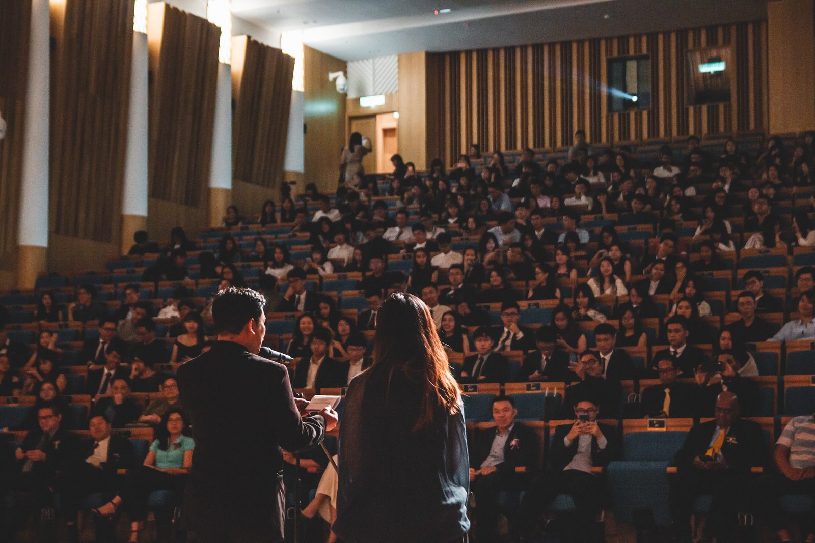 A presenter addressing a professional audience